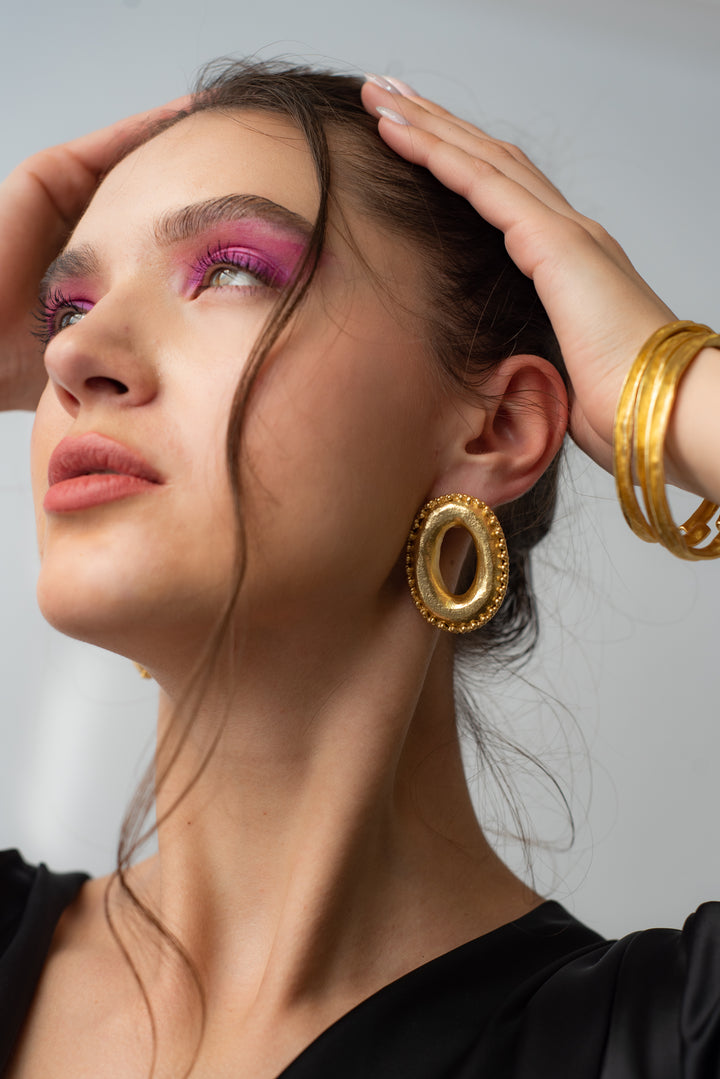 Close up view of anti tarnish 18k gold plated statement hoop earrings for women