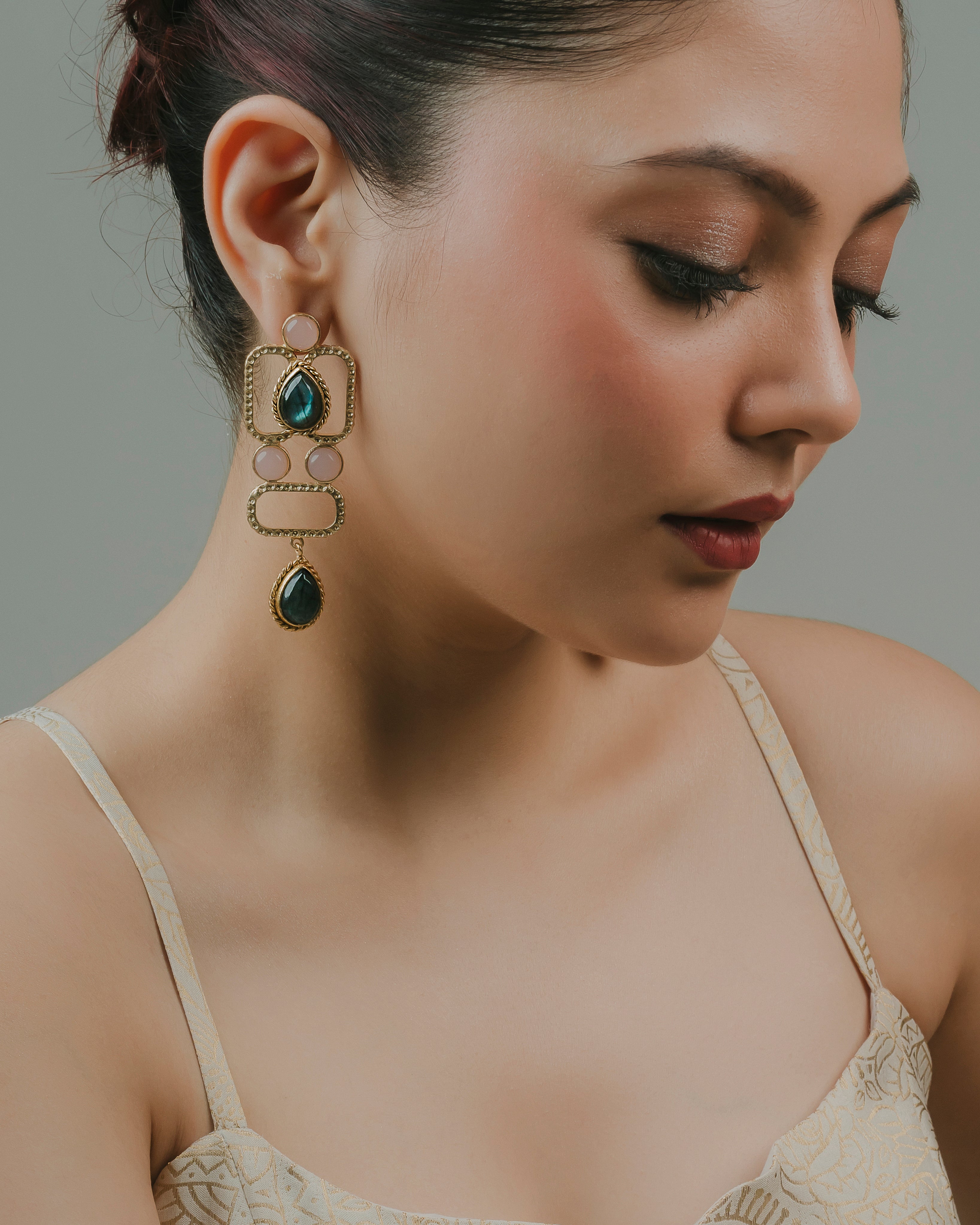 antique geometric statement earrings in gold-toned brass, styled with ethnic wedding attire.