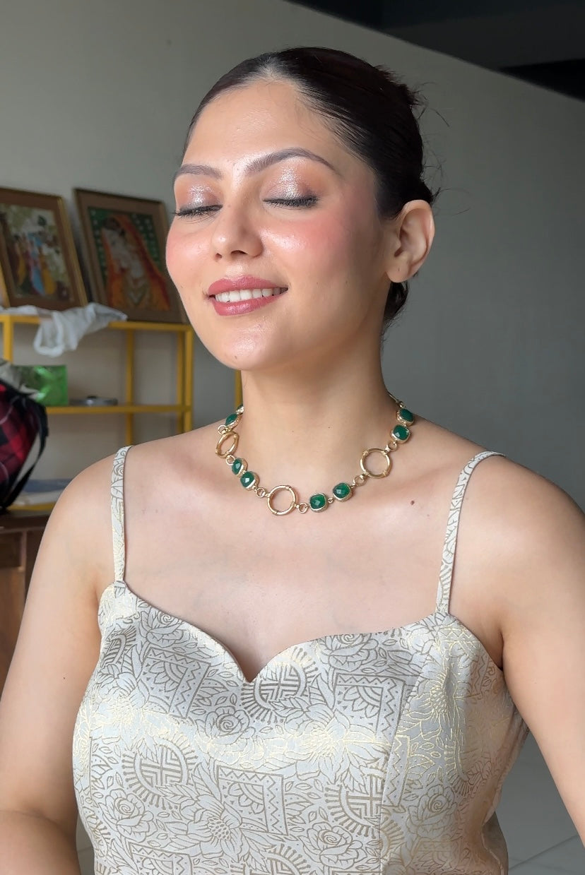 long gold-toned brass Y-necklace set with green stones