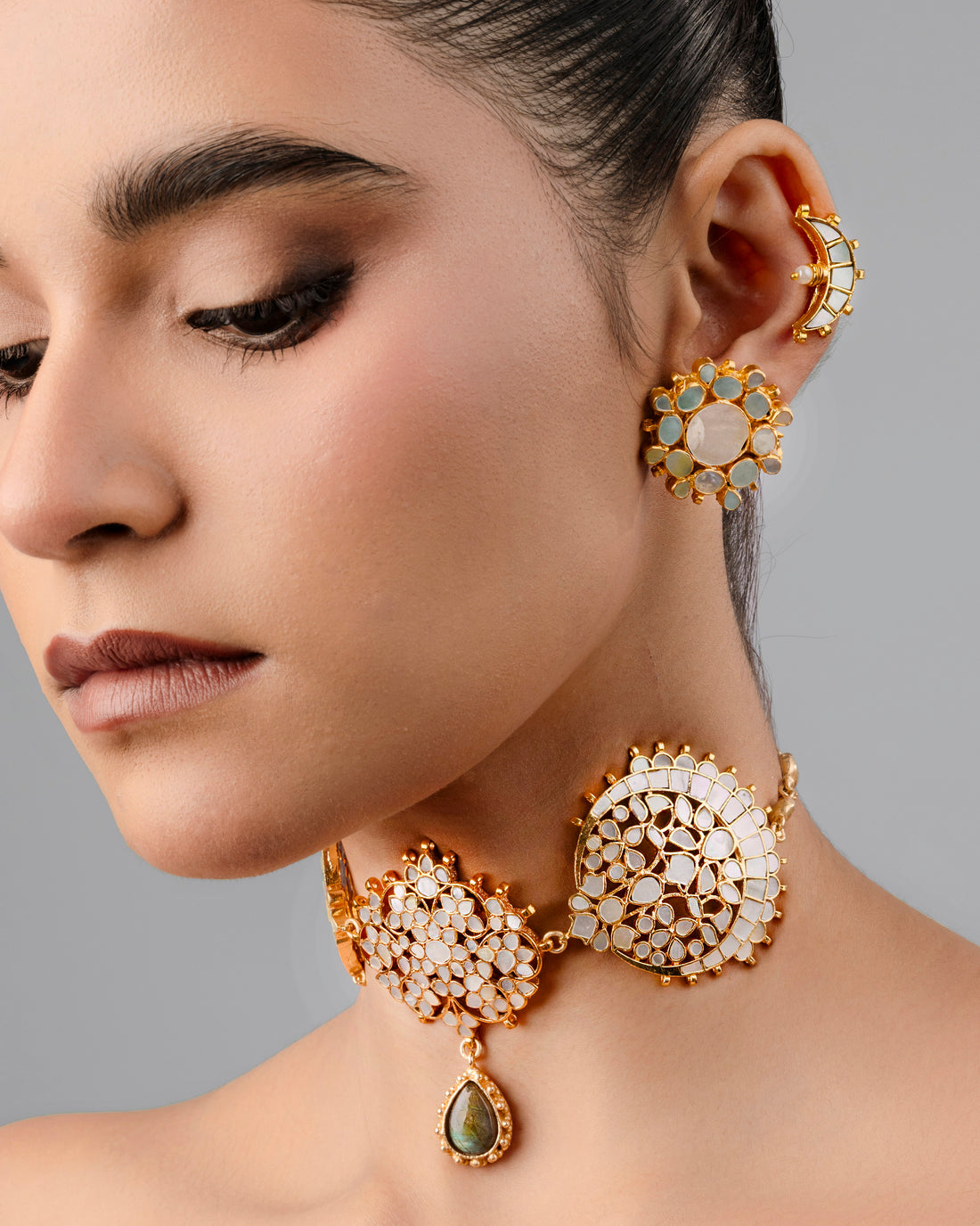Handcrafted gold-plated Mother-of-Pearl Kundan choker necklace with meenakari details for festive wear.