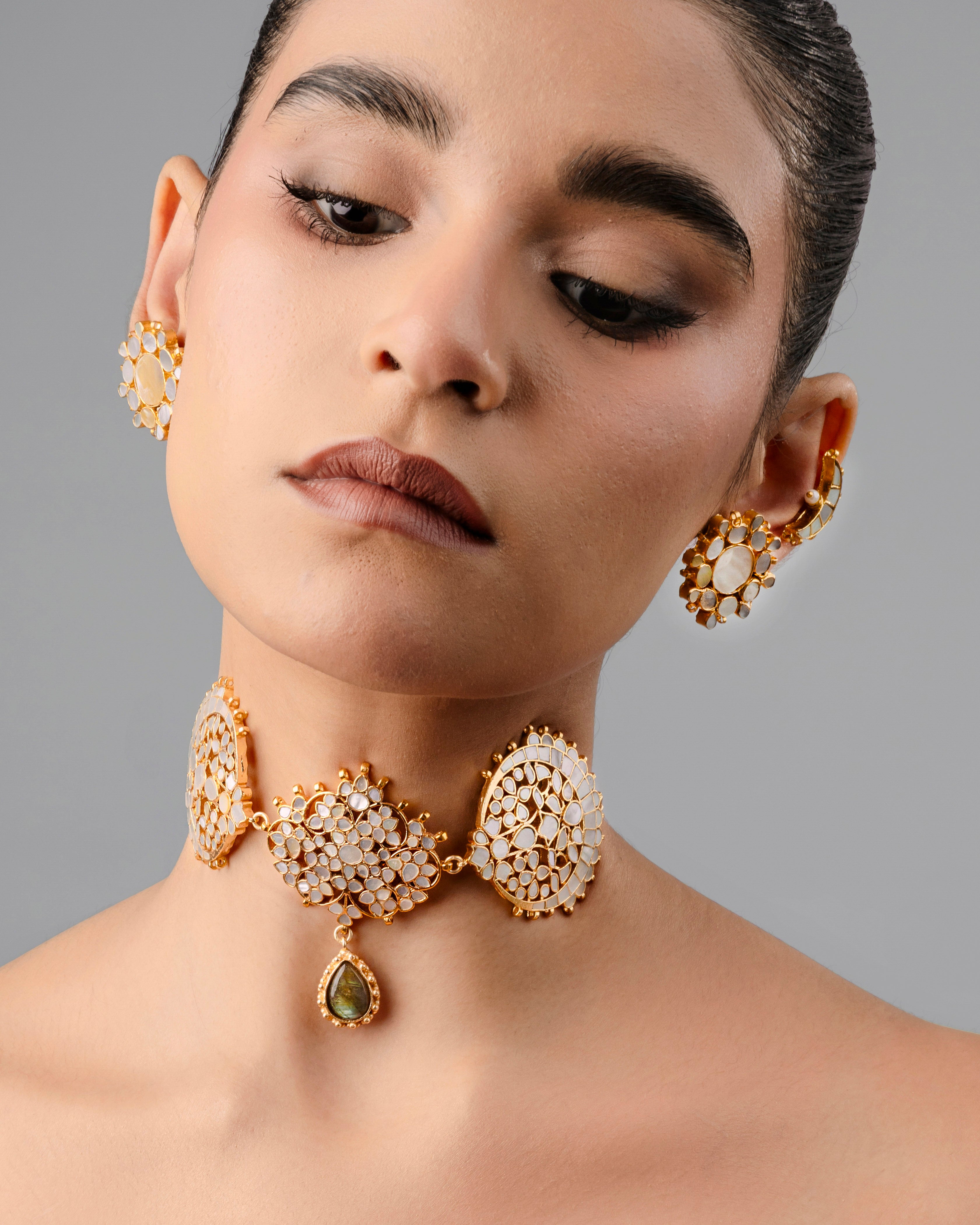 traditional Indian gold-toned choker necklace featuring a kundan-style design