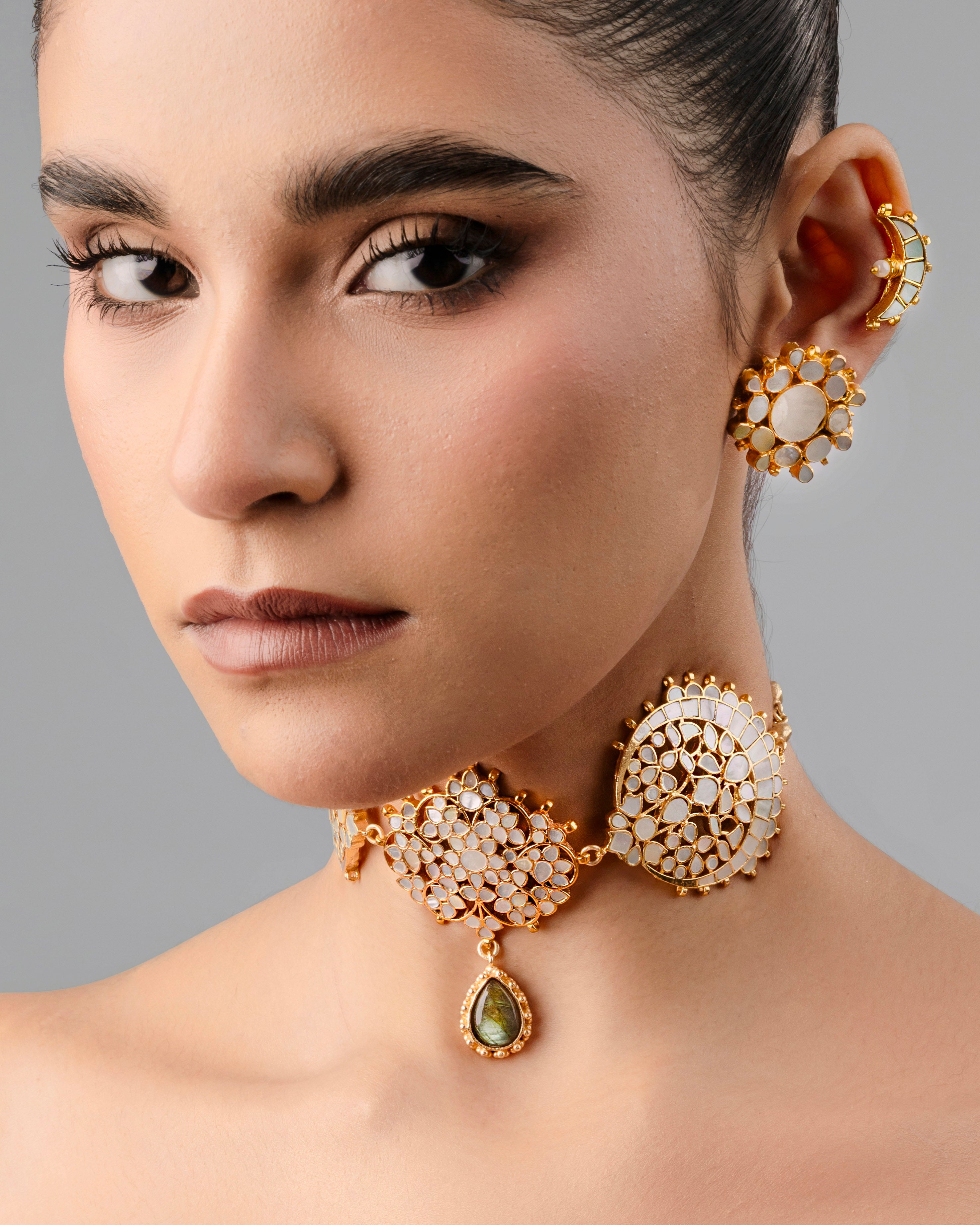 Handcrafted gold-plated Kundan choker necklace featuring intricate green and red meenakari work.