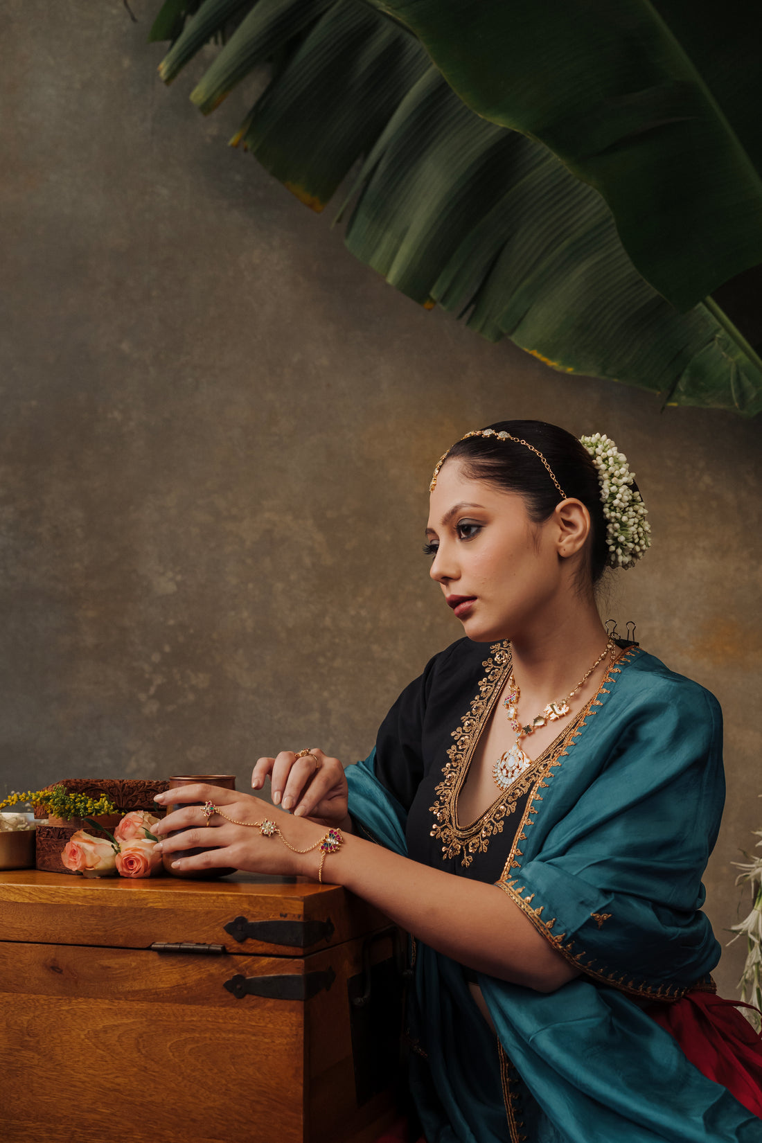 Model in traditional Indian bridal attire wearing a gold-plated Chand Mathapatti for wedding festivities