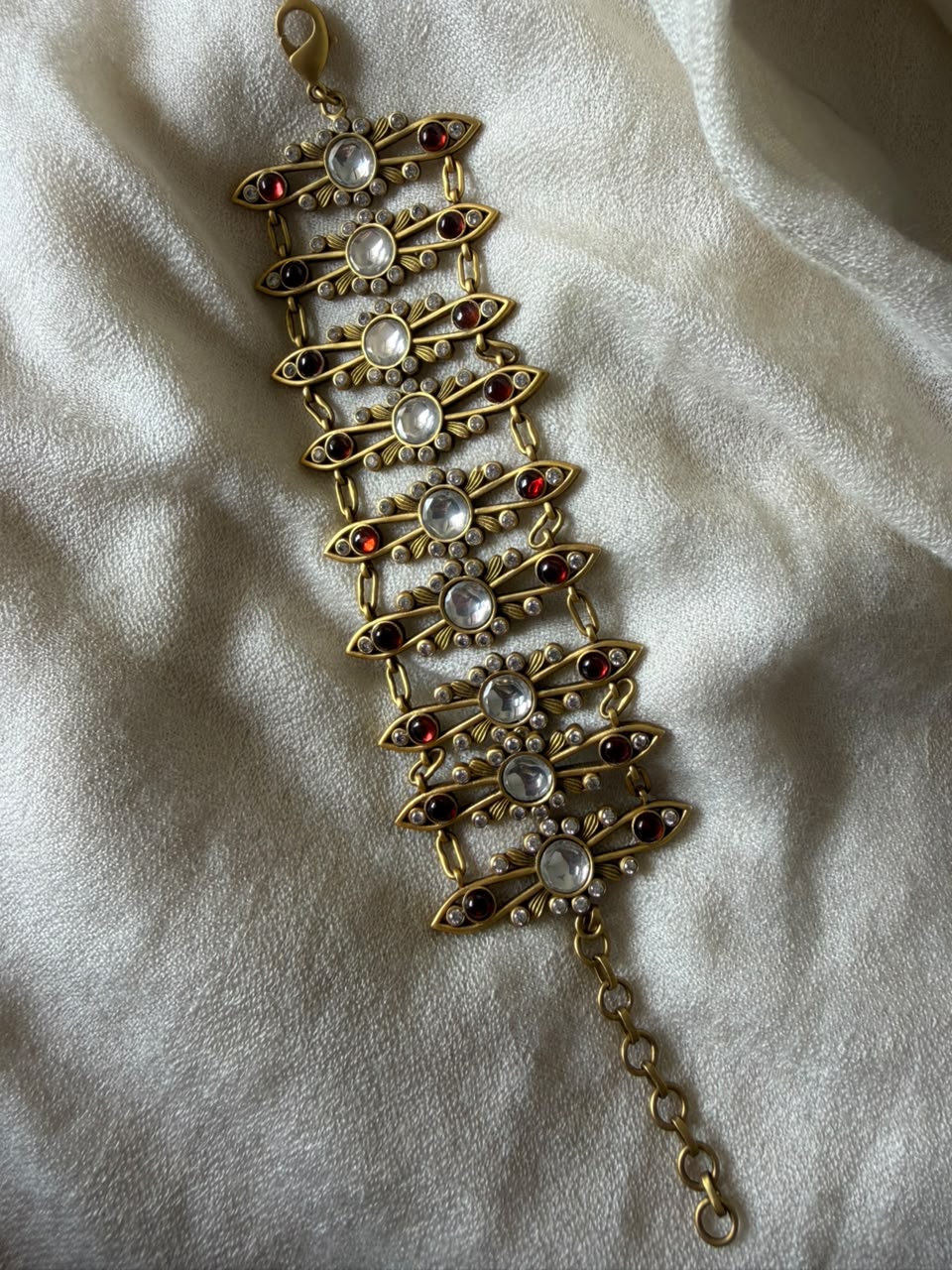 buy cherry red kundan meenakari chain bracelet for a wedding. 