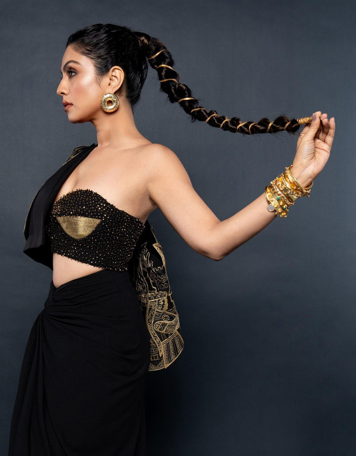 Minimalist gold-plated chunky donut hoop earrings styled with a chic black outfit for contemporary look
