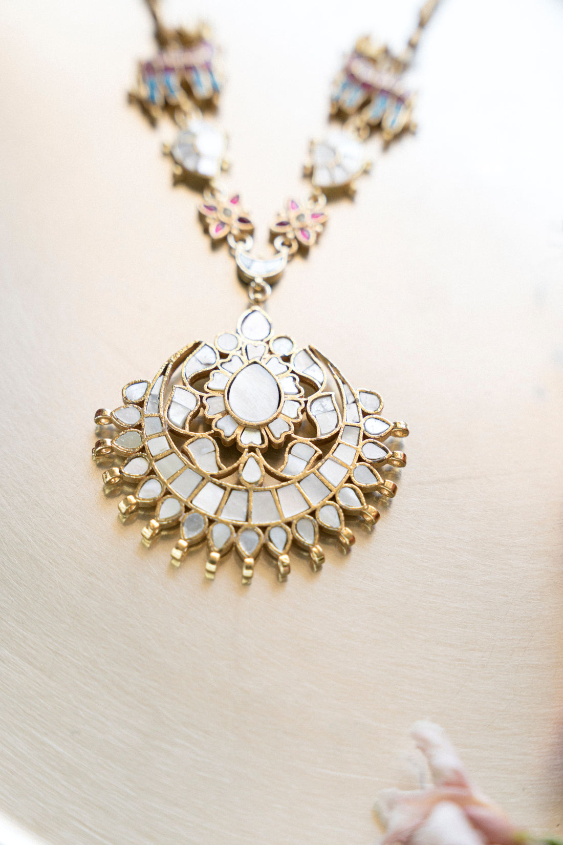 Woman wearing Elefleur Royal gold plated MOP Kundan necklace with traditional ethnic outfit