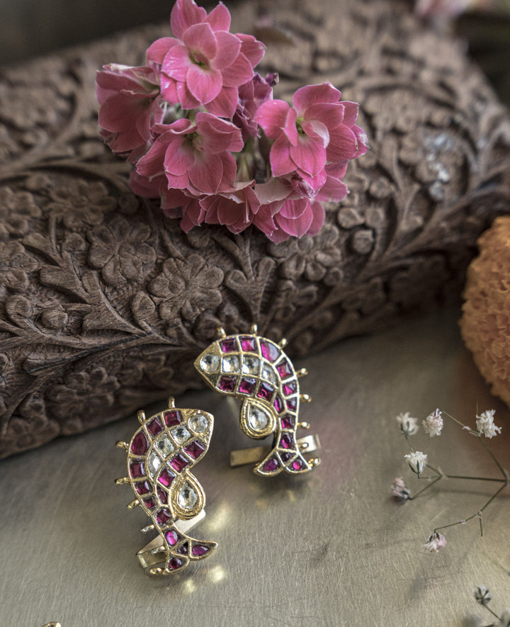 An anti-tarnish goldfish ear cuff, styled dynamically for a luxury jewellery collection.