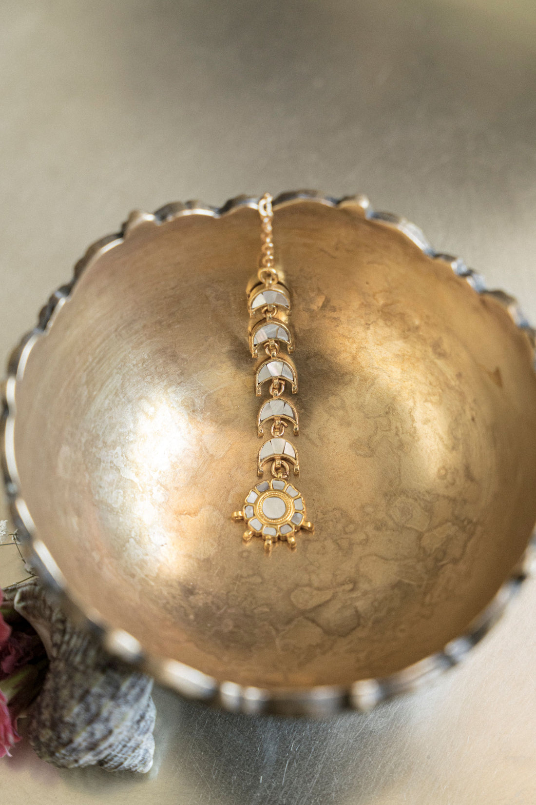 Gold-plated Chand Mathapatti with pink floral accents and mother-of-pearl half-moon layout