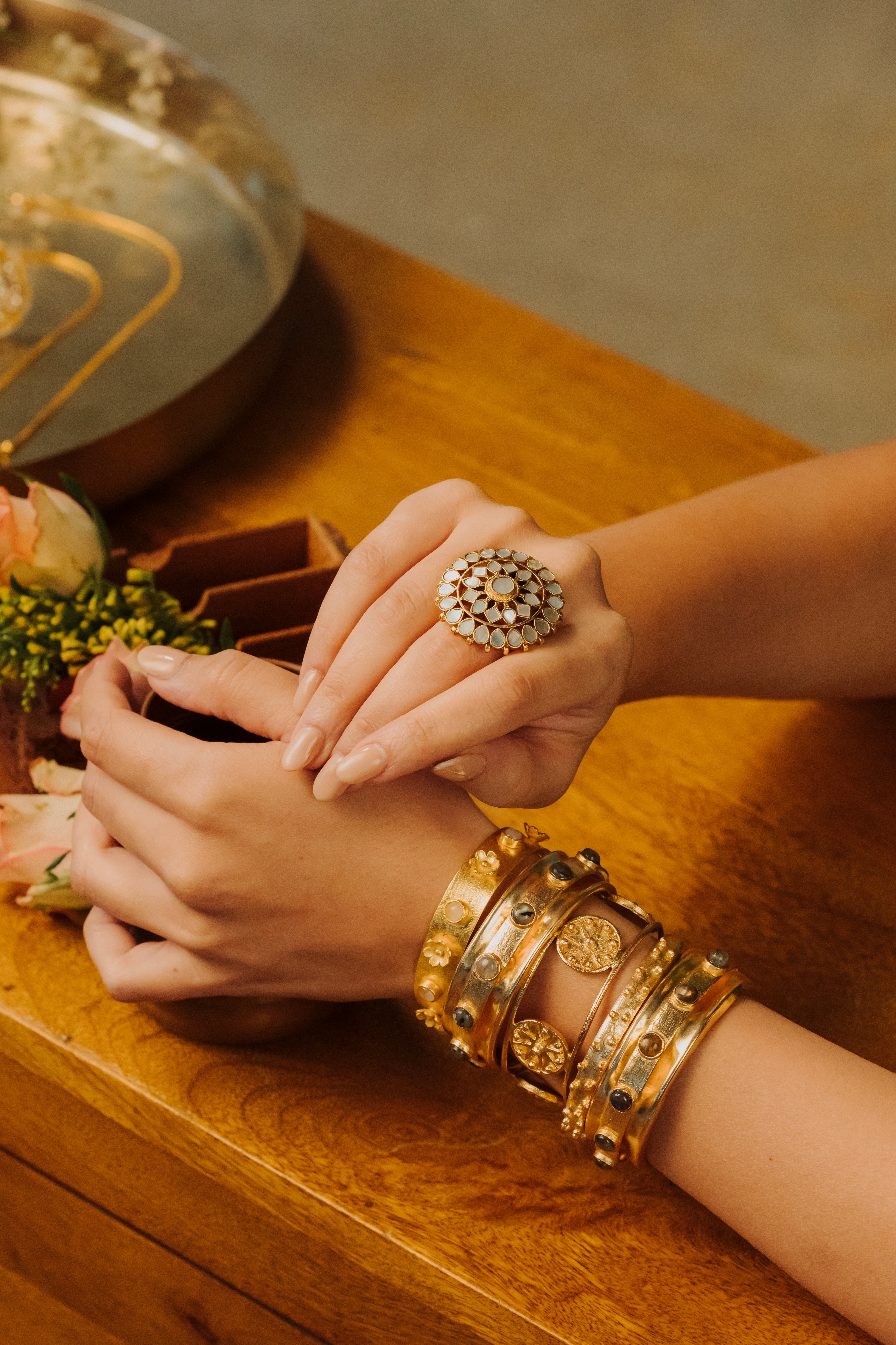 Gold plated women's bangle stack set handcrafted with intricate traditional details
