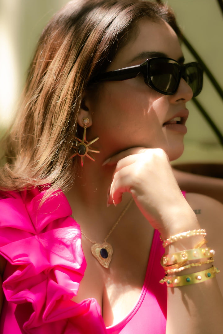 Ethically handmade brass gold plated bangles with floral motifs and spiked accents