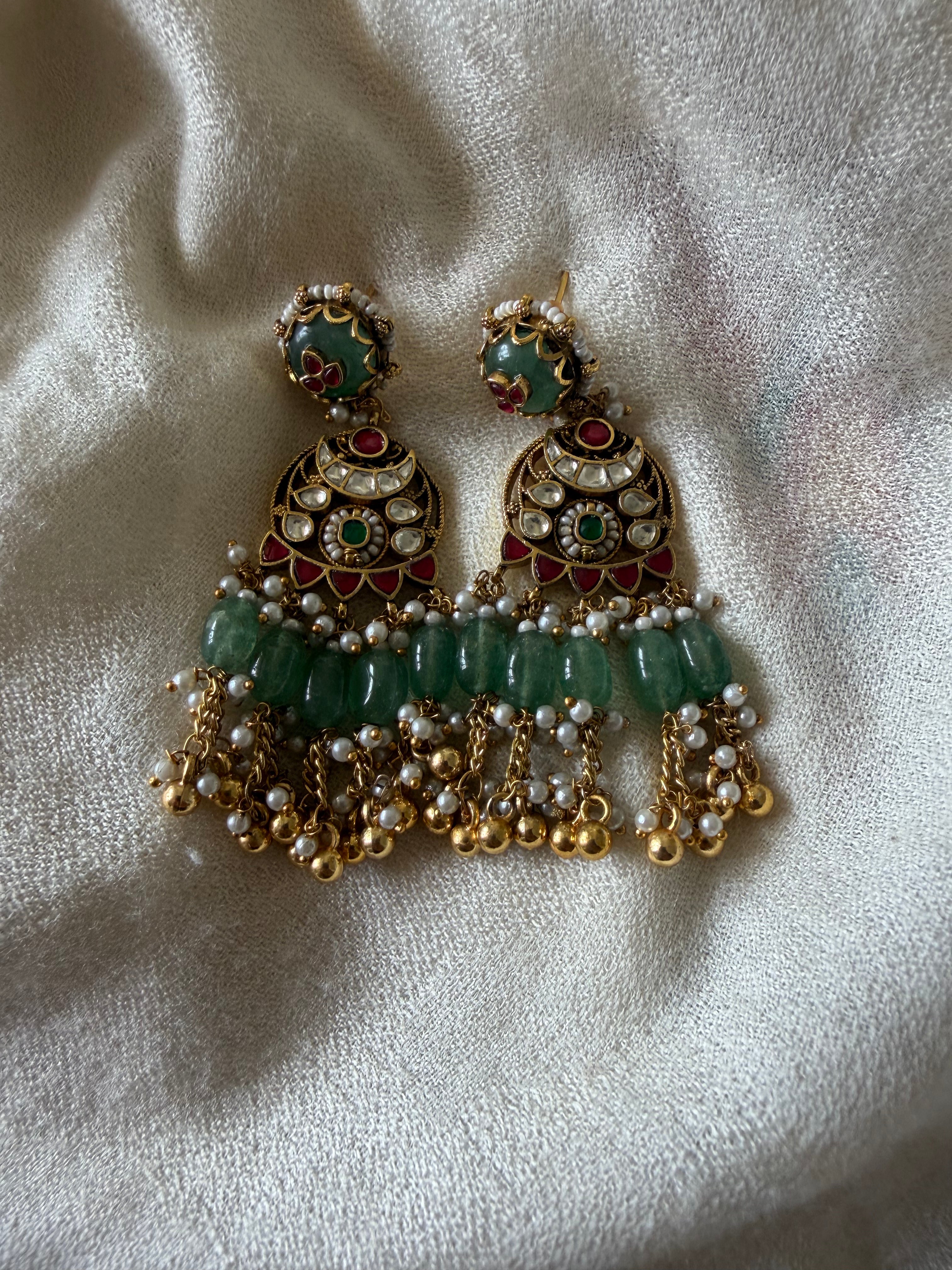 traditional red kundan drop earring with green bead clusters for women