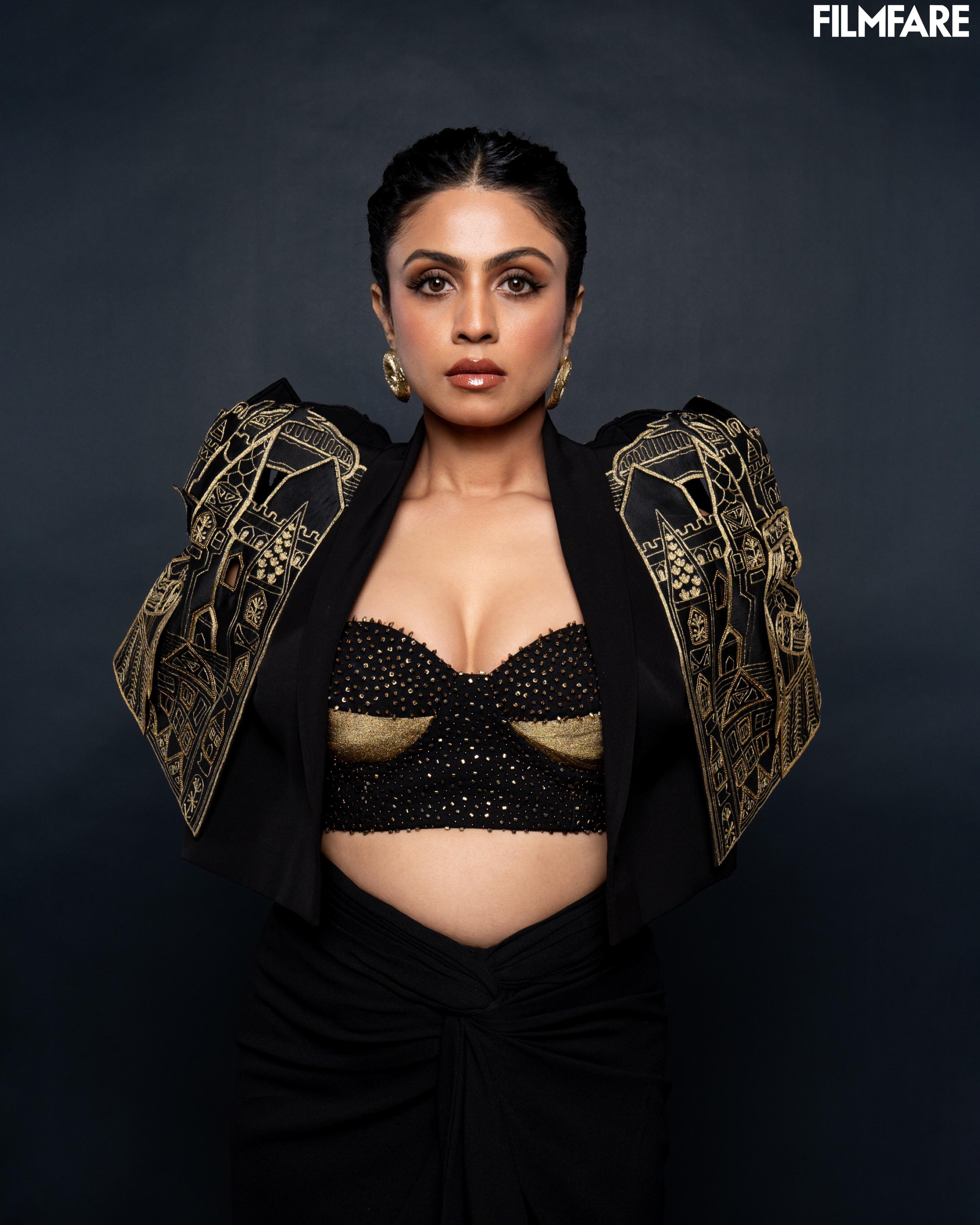Mansi Parikh styled in gold-toned chunky donut hoop earrings with funky jacket