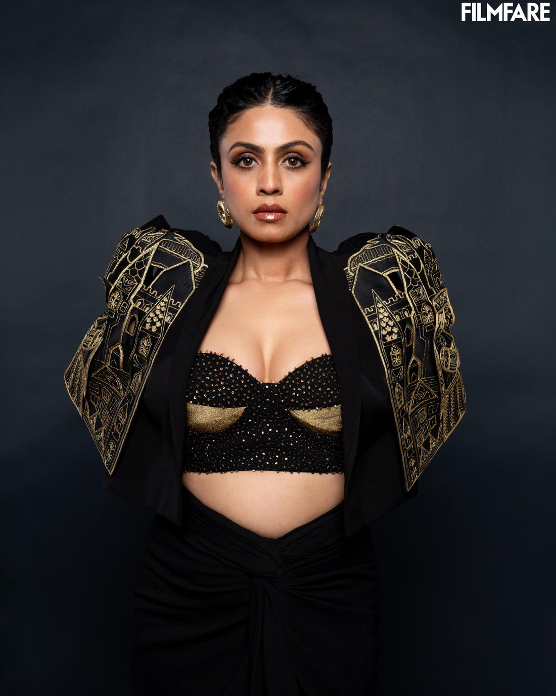 Mansi Parikh styled in gold-toned chunky donut hoop earrings with funky jacket