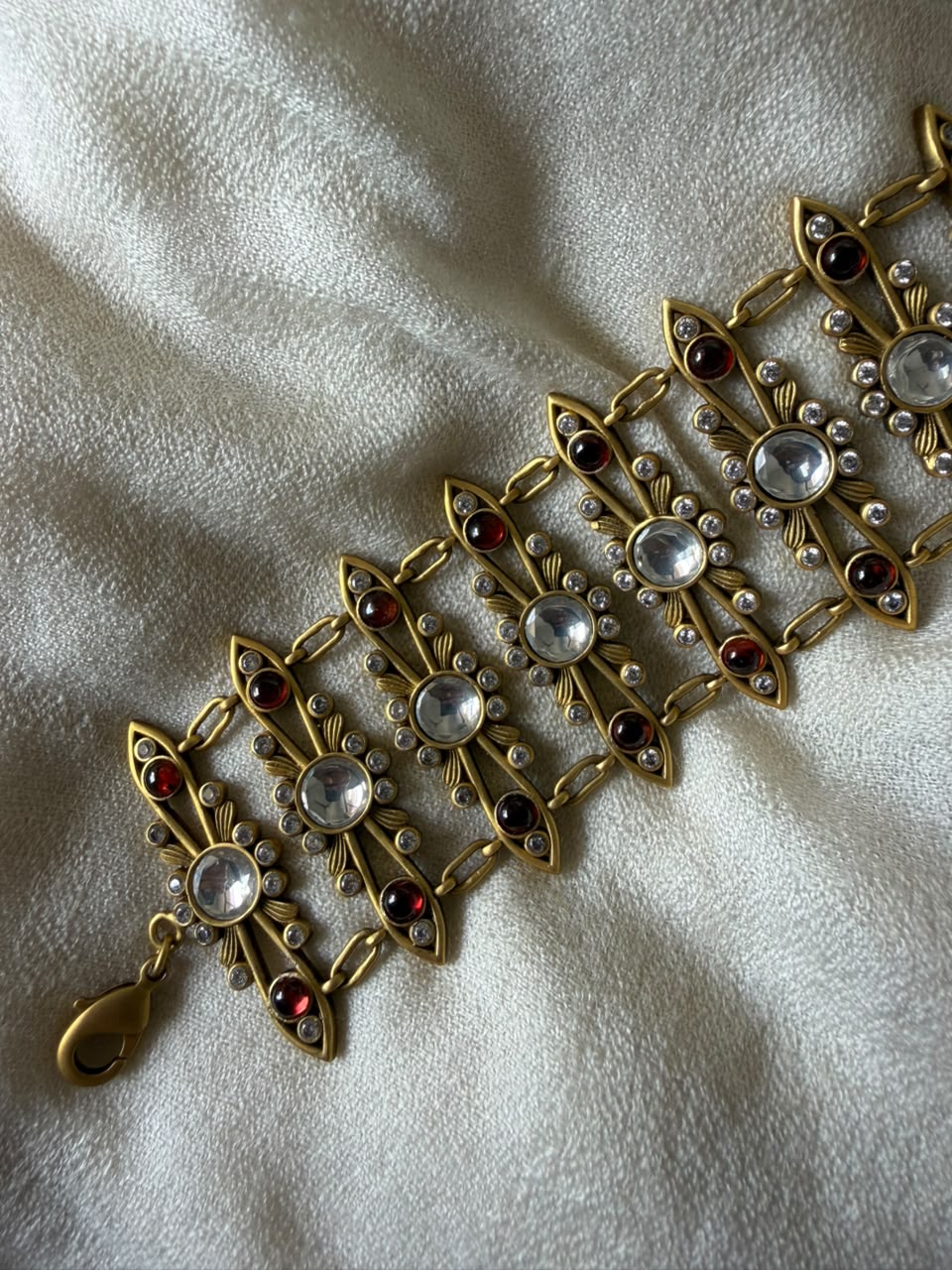 Buy a rich ruby red Kundan pearl meenakari chain  bracelet in India.