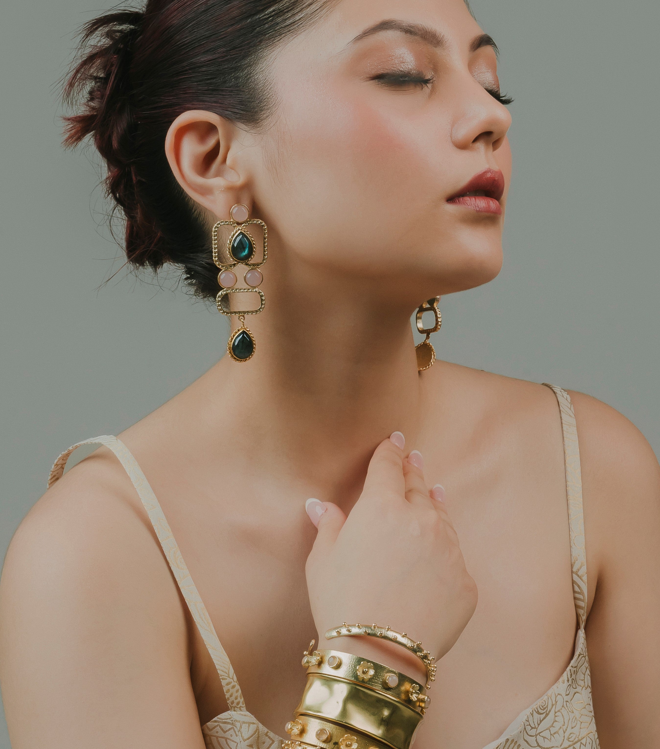 square gold-finish ethnic drop earrings designed with traditional geometric brass craftsmanship.