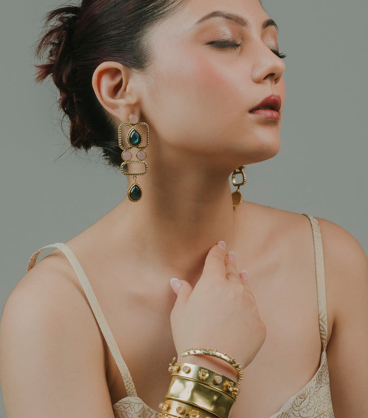 square gold-finish ethnic drop earrings designed with traditional geometric brass craftsmanship.