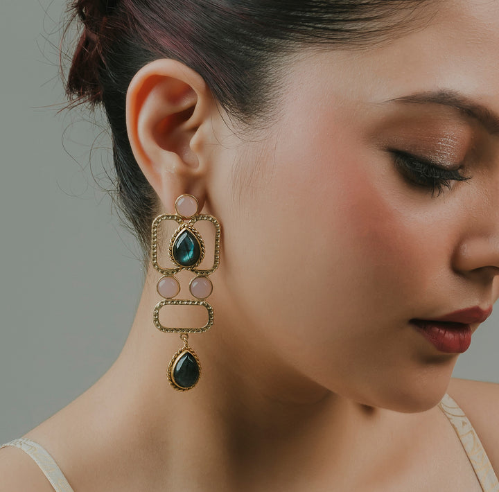 gold-toned brass squared traditional dangle earrings featuring a geometric drop design and green stone detail.
