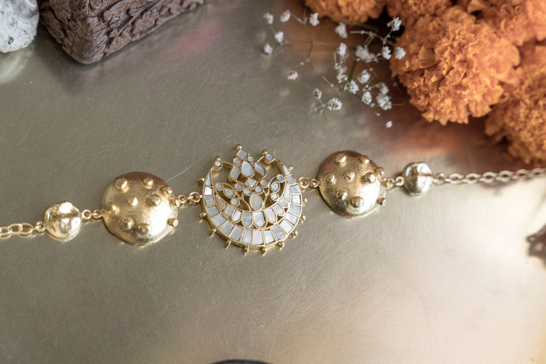 Traditional gold-plate mother-of-pearl chand necklace styled with a floral motif.