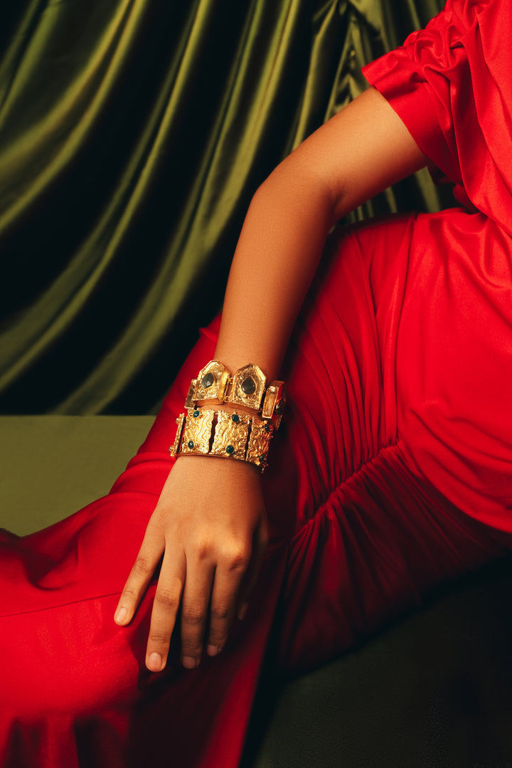 gold statement stack kadas featuring rectangular green and turquoise gemstone panels.