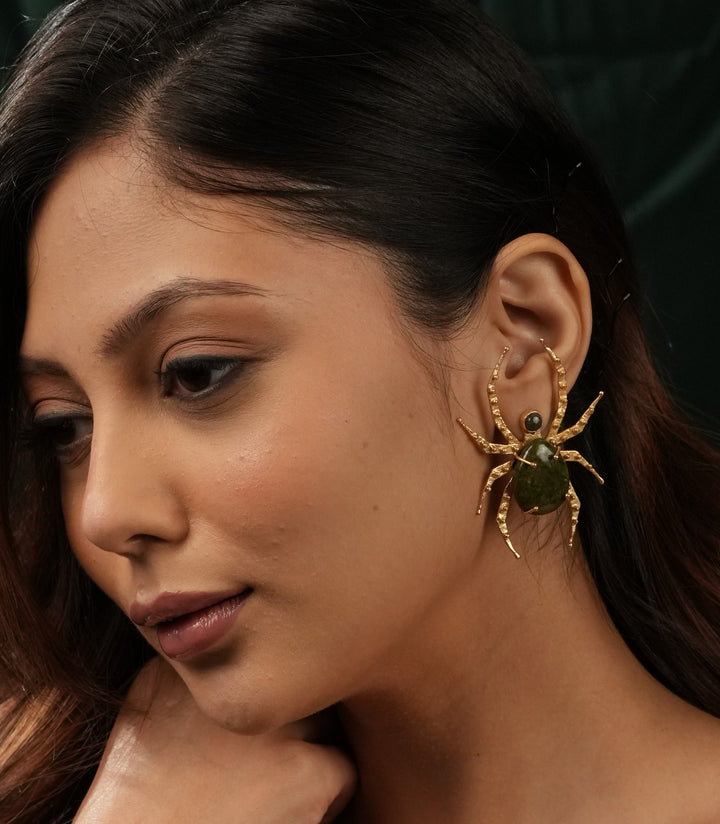 Baala Jewels gold-plated spider stud earrings styled on model