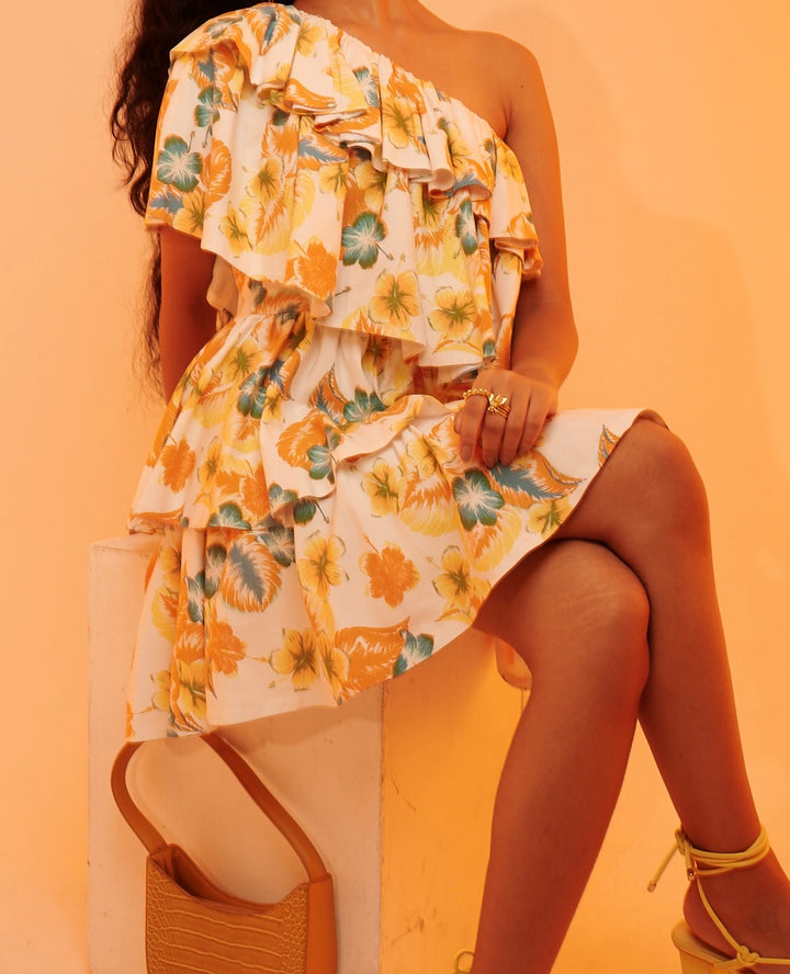 a girl wearing yellow summer minidress with our bees motif ring 