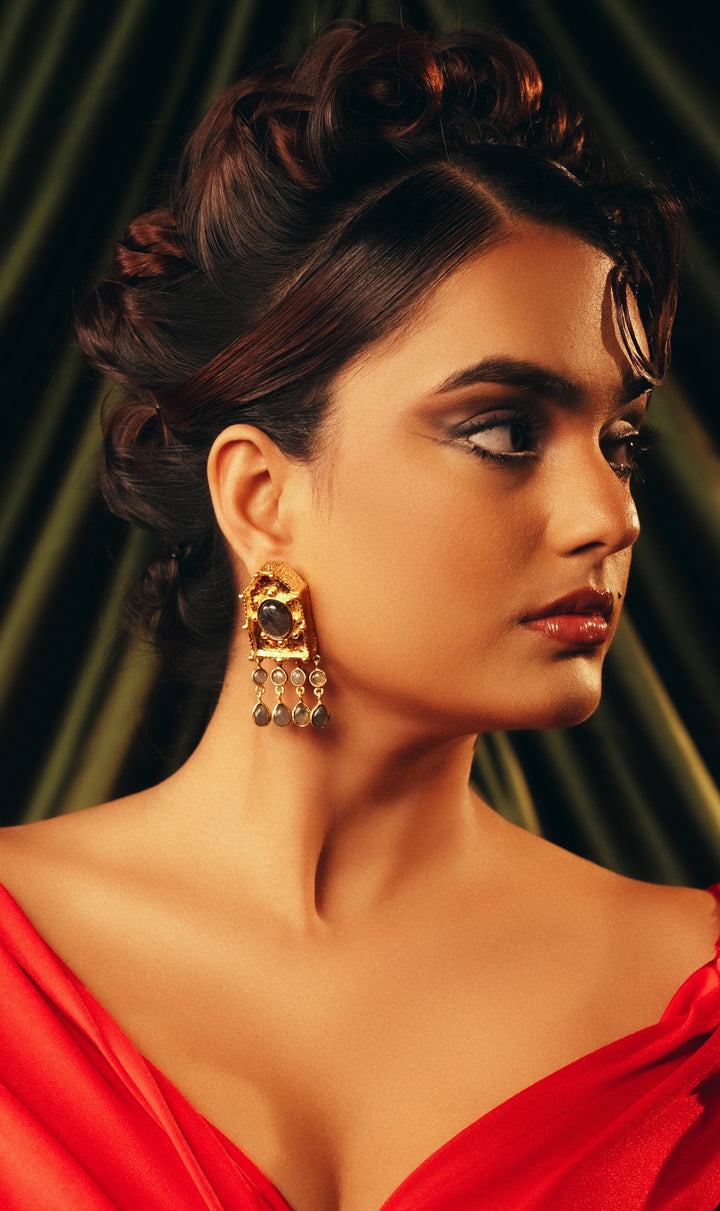 Model wearing BaalaJewels Ebon Eclat 18k gold-plated drop earrings with ruby zoisite stones