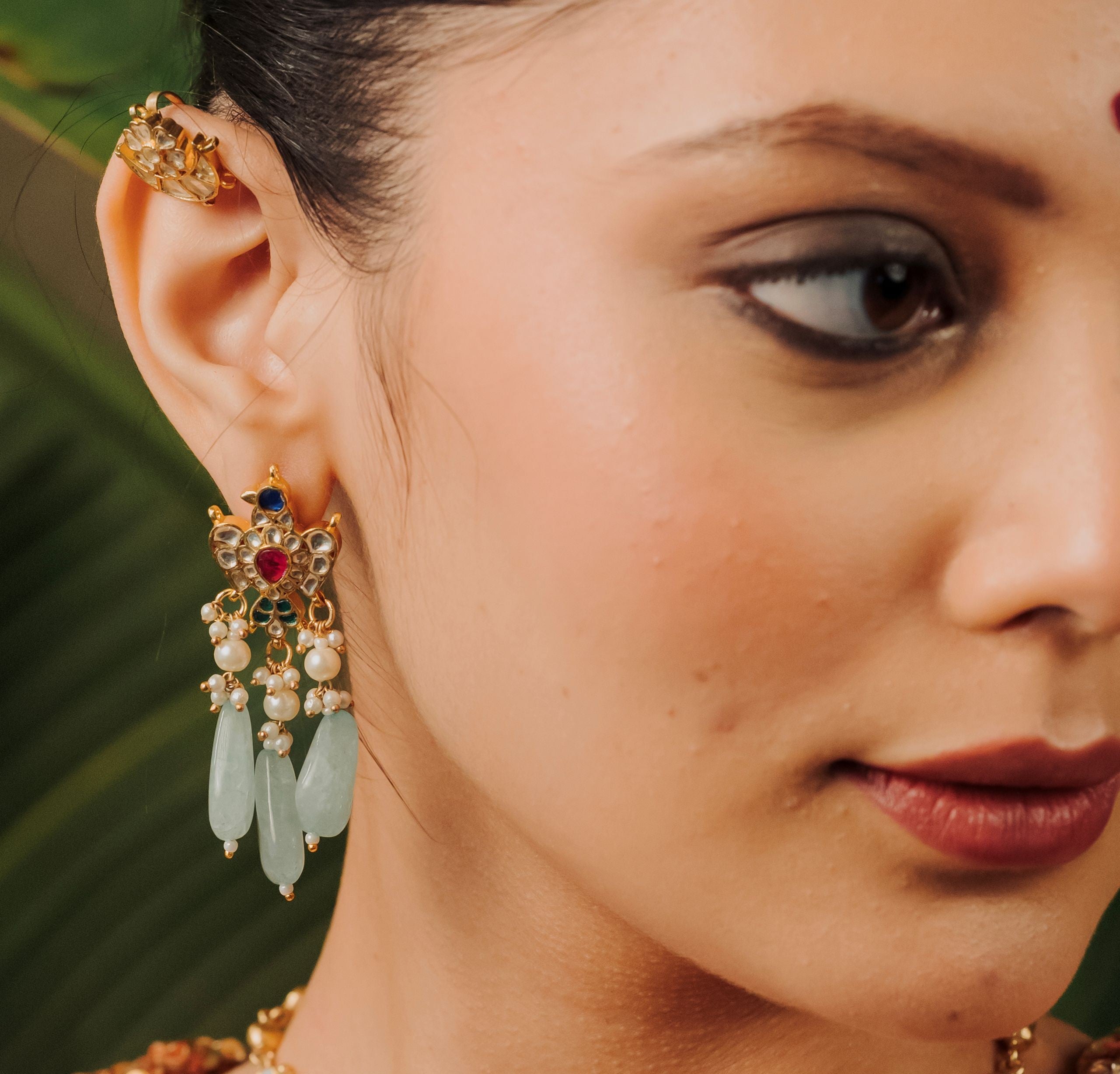Baalajewels Mohini Kundan necklace and earring set featuring mother-of-pearl and green stone detailing.
