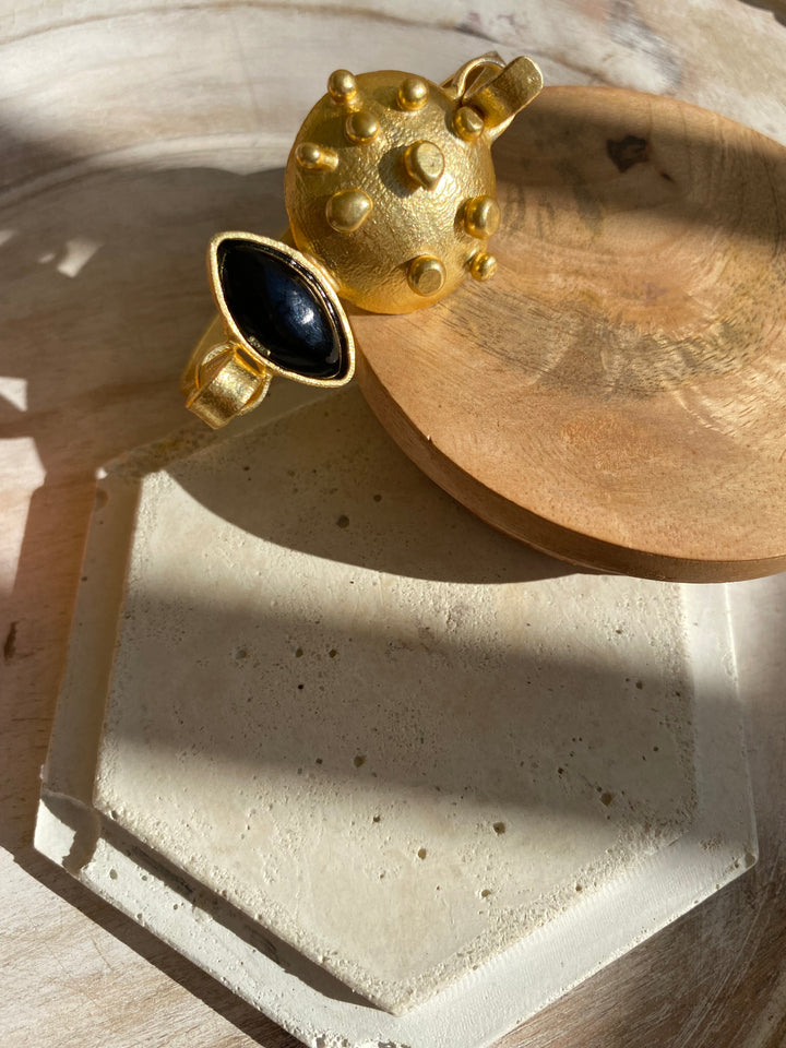 Adjustable gold cuff lock bracelet for women featuring geometric oval design