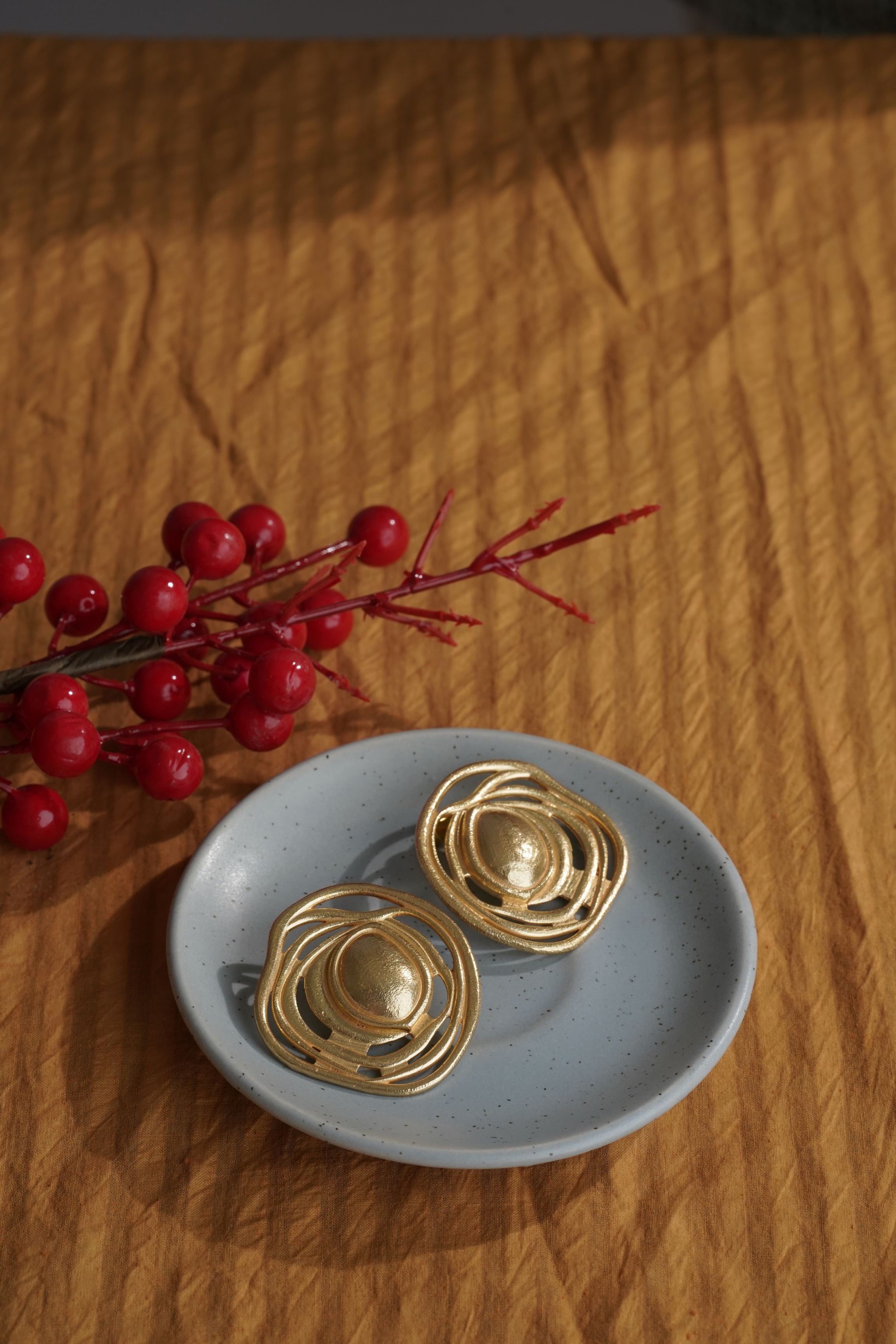Buy chunky gold round stud earring for women.