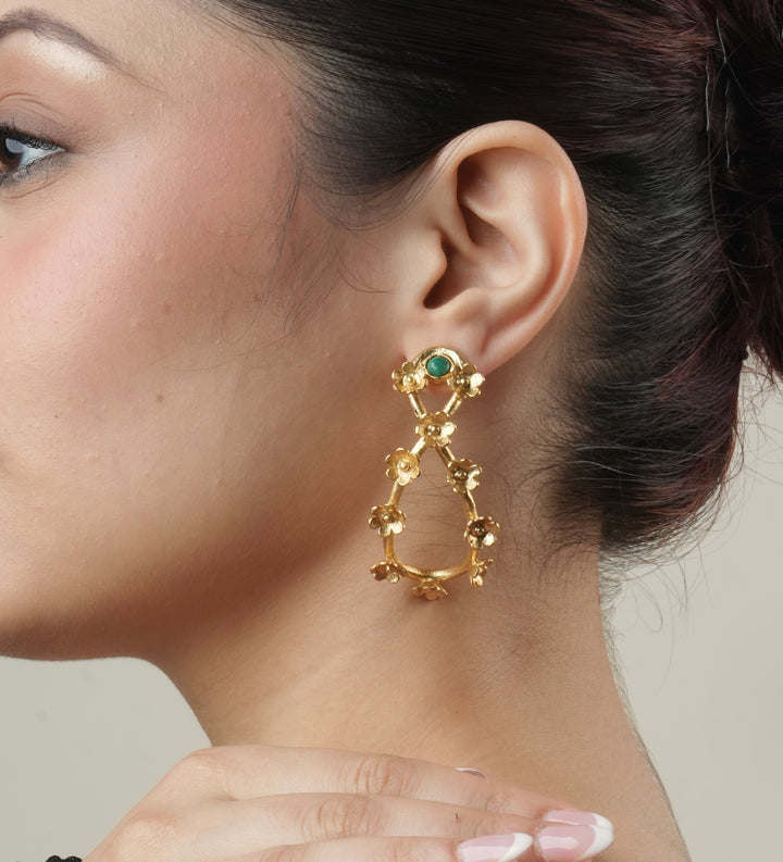 Gold-plated brass floral drop earrings featuring a green stud stone