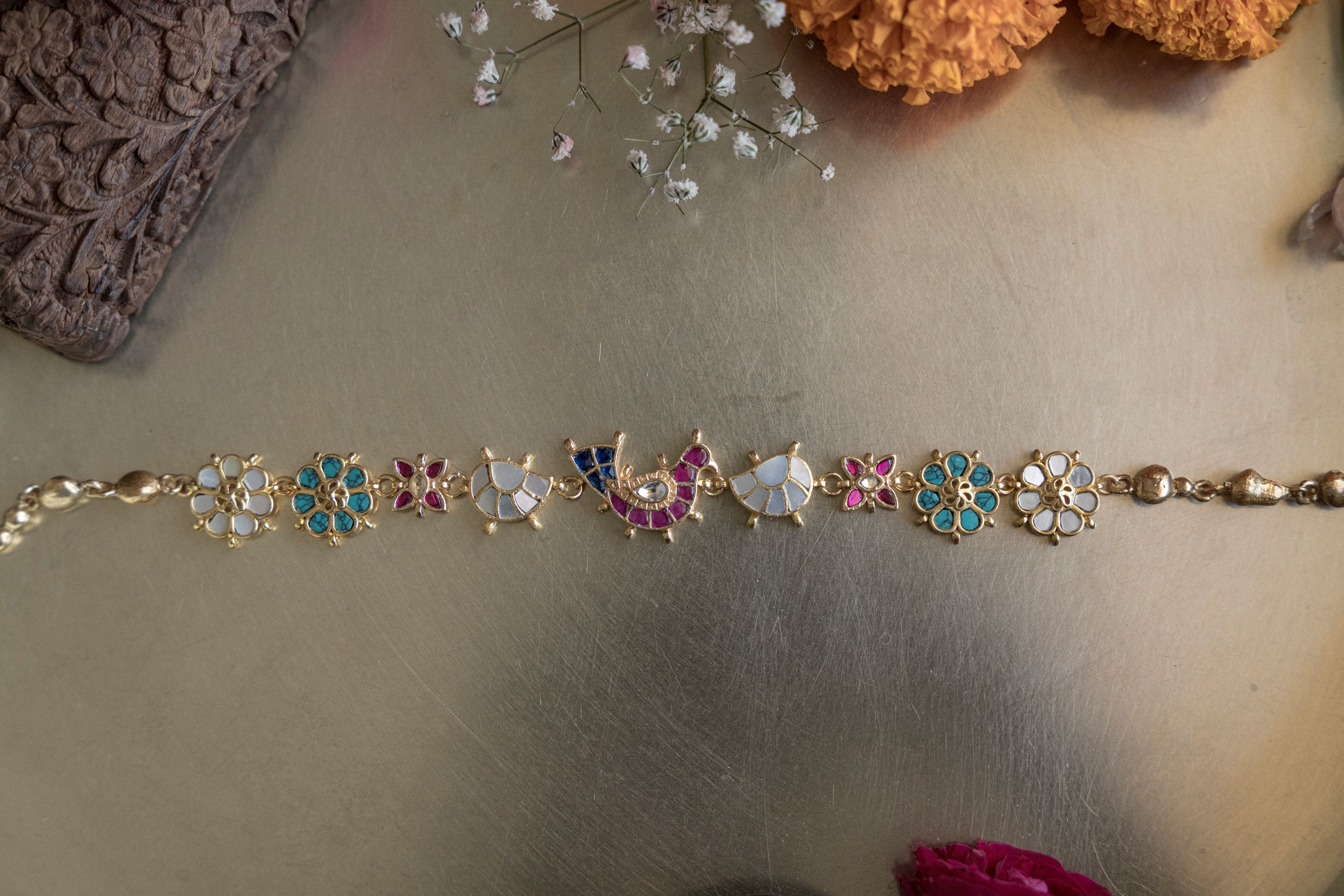 Gold-plated floral Kundan choker necklace with mother of pearl accents and drop earrings