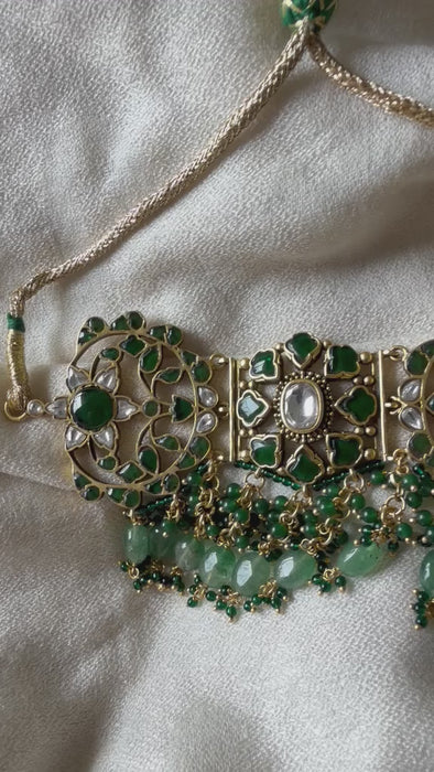 Royal Indian bridal green Kundan choker necklace set with detailed craftwork for weddings and festive wear.