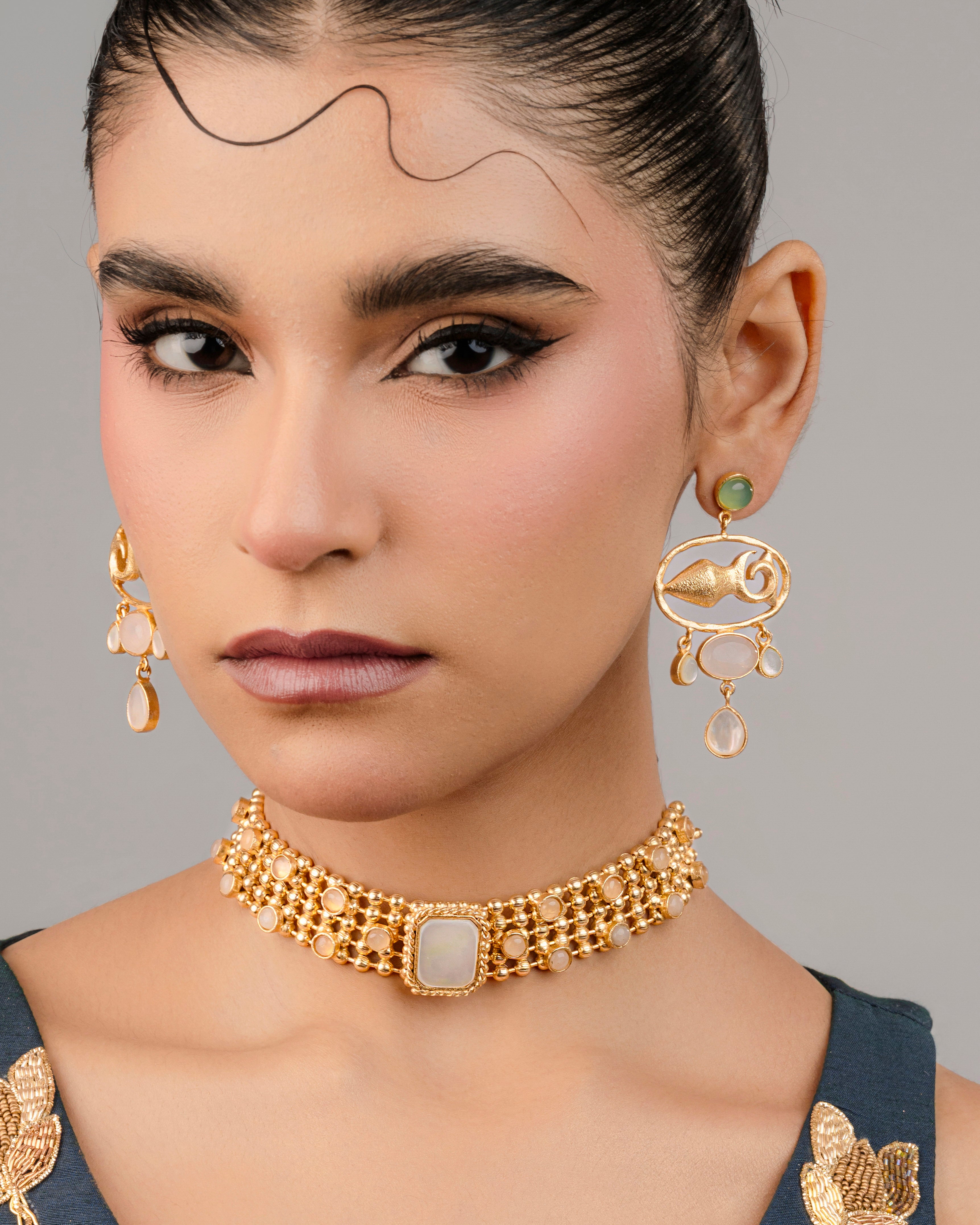 Stone jewelry set with a fish motif and white stone choker for women. ideal for traditional wear 