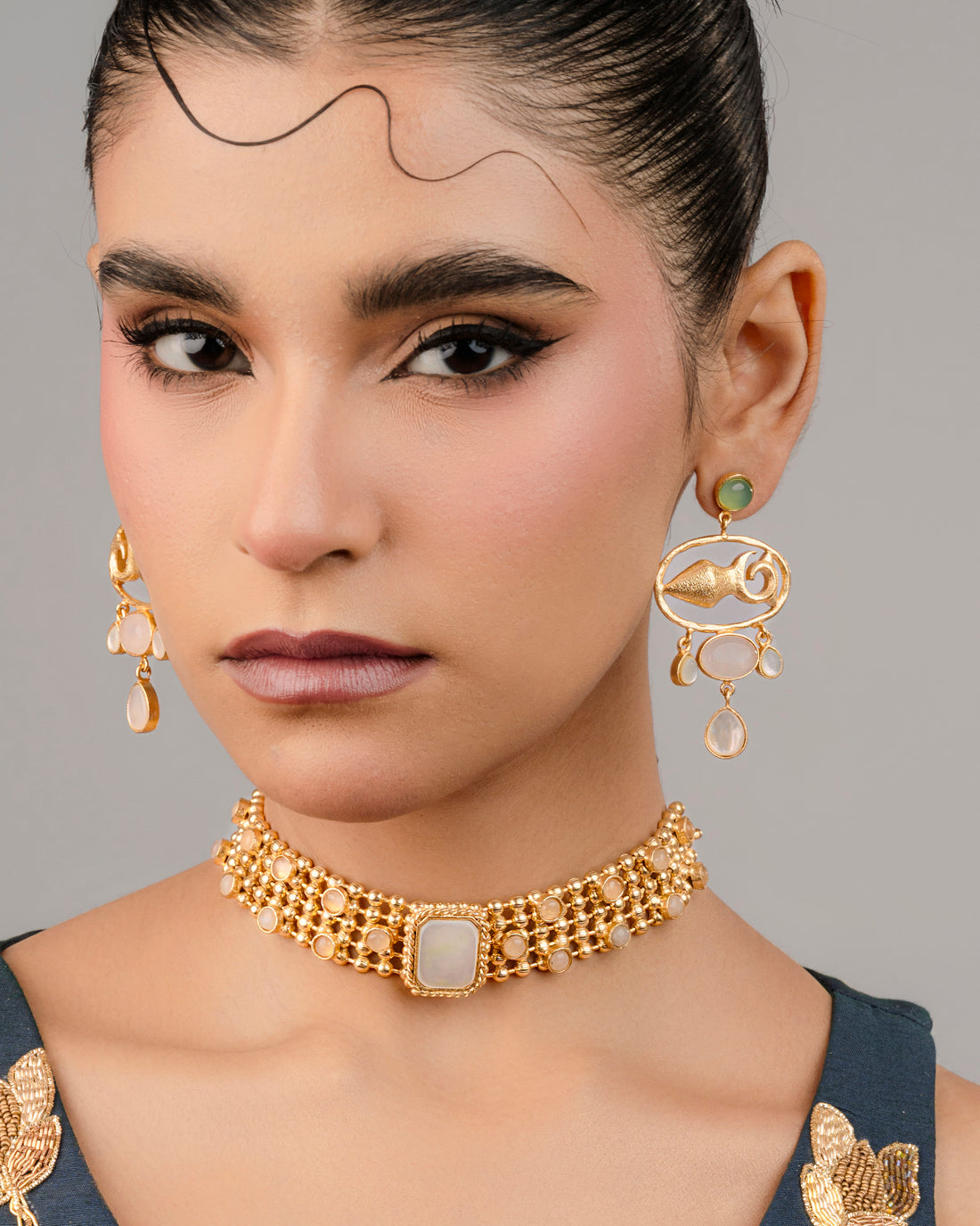 Stone jewelry set with a fish motif and white stone choker for women. ideal for traditional wear 