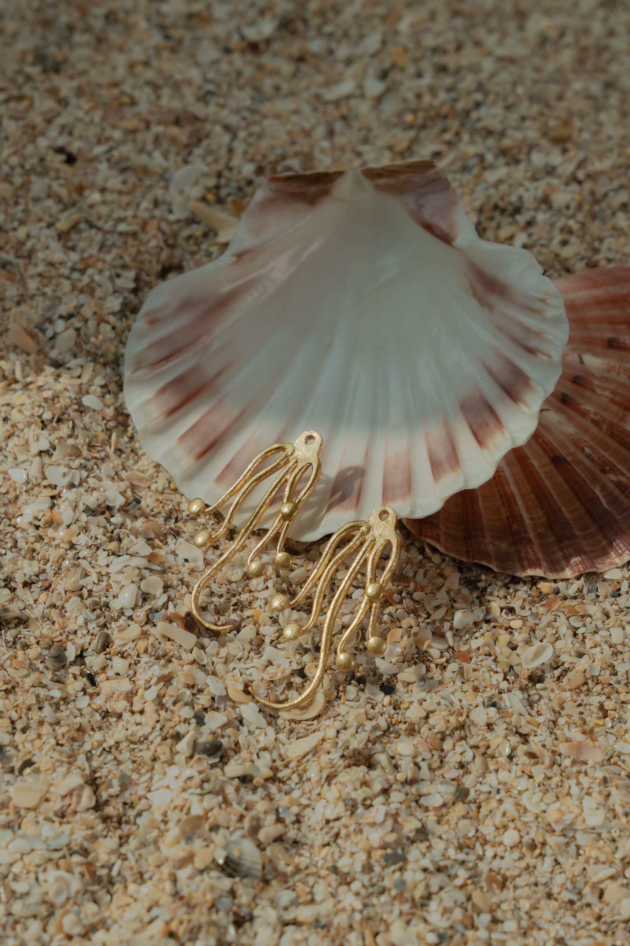 Gold octopus earrings ideal for resortwear, tropical vacations, and summer beach parties